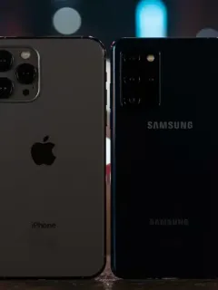 iPhone 18 Pro Max and Samsung Galaxy S36 Ultra flagship smartphones side by side in low-light setting
