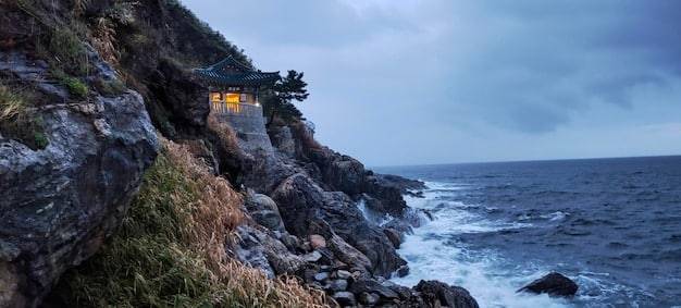 A picturesque scene from Jeju Island, South Korea, featuring its volcanic landscape, coastal views, and a modern building that served as a filming location for a K-drama.