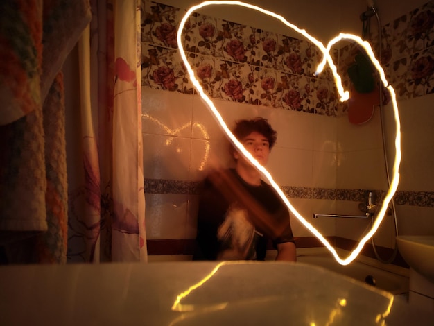 A close-up shot of a second lead character looking longingly at the main lead, conveying a sense of unrequited love and longing. The scene is set in a romantic, softly lit environment.