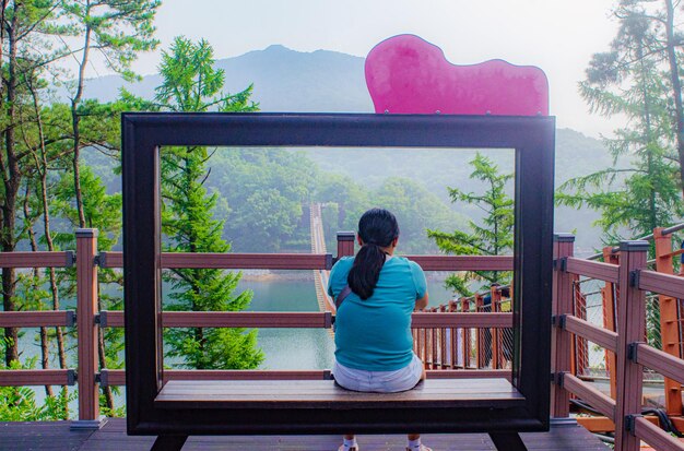 A screen capture from a popular K-drama showcasing a classic love triangle scene. The image should prominently feature the main character flanked by the two competing love interests, with visible tension and emotional expressions on their faces.