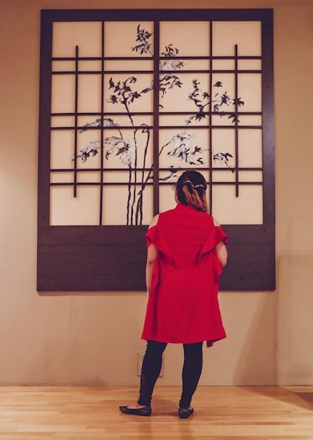 A split image showcasing a character in a historical C-drama wearing a traditional Hanfu with intricate embroidery, alongside a more contemporary take on the Hanfu style, featuring similar silhouettes and design elements but using modern fabrics and colors.