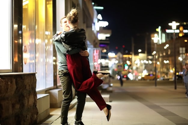 A charming image of a young couple sharing a romantic moment in a bustling modern city, with skyscrapers in the background and vibrant city lights illuminating the scene.
