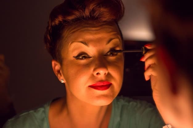 A close-up shot of a makeup artist applying subtle eyebrow makeup on an actress, using a fine brush and natural-toned powder. The focus is on the precision and technique involved in creating a natural eyebrow look.