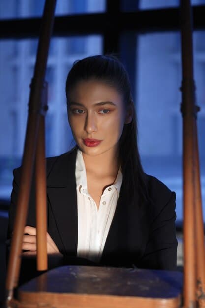 A close-up shot of a modern Chinese drama's female lead, dressed in business attire, confidently addressing a boardroom. Her expression is sharp and intelligent, representing her professional prowess in a male-dominated field.