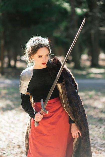 A scene from a historical Chinese drama where the female lead, dressed in armor, stands before her army, giving a motivational speech. The lighting highlights her face, conveying determination and courage, inspiring strength and leadership.