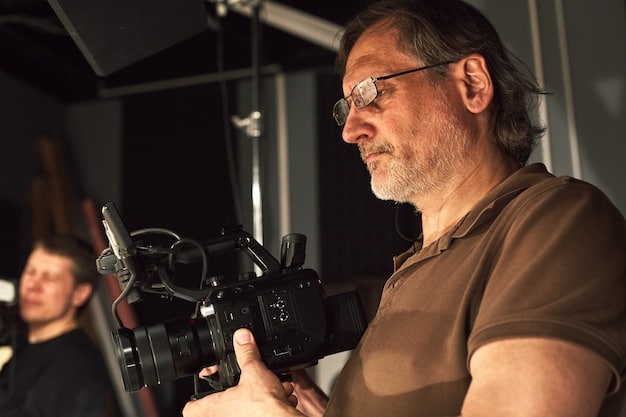 A close-up shot of a director reviewing footage on set during the filming of a potential 