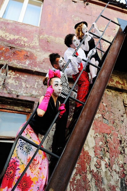 A scene from a Japanese drama featuring a diverse cast of actors and actresses from different cultural backgrounds. The scene captures a moment of interaction, highlighting the theme of inclusivity and representation in storytelling.