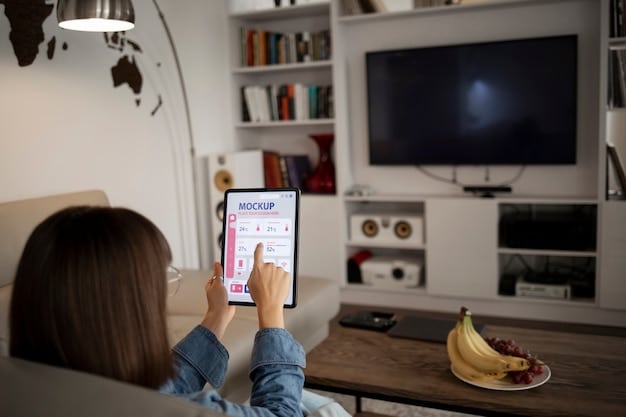 A living room setup featuring an Apple TV connected to a large screen TV, with an iPad and iPhone mirroring content onto the TV screen, showcasing Apple ecosystem integration.